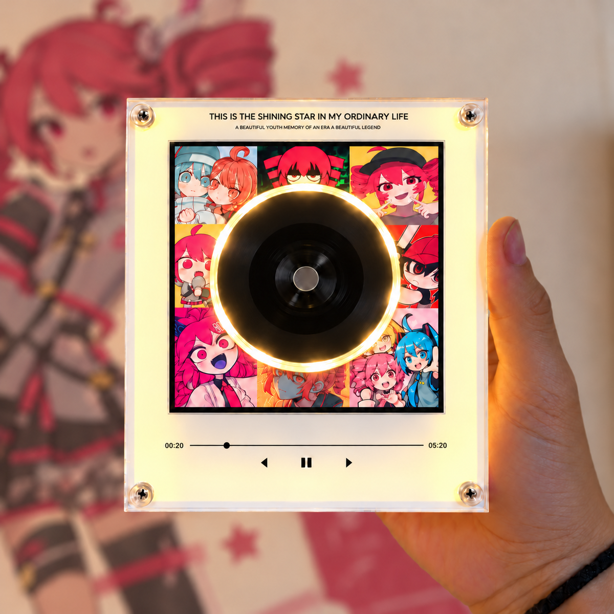 Song Collector Teto acrylic music player held in a hand with a warm yellow glow